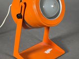 an orange lamp that is on a table