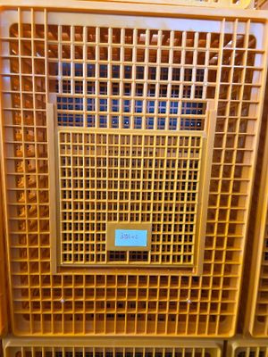 many crates that are stacked on top of each other
