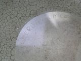 a silver plate with writing on it sitting on a table