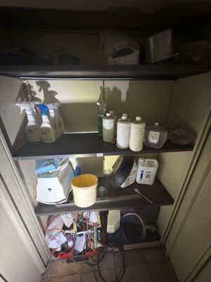 a shelf that has a lot of items on it