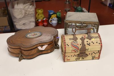 a small wooden box and a small wooden box sitting on a table