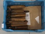 several cigars are in a plastic container on a tile floor