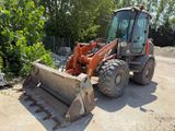 a tractor that is sitting in the dirt