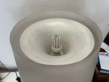 a light that is on in the middle of a table