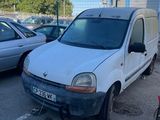 a white van parked in a parking lot next to other cars