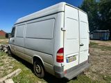 a white van that is parked in the grass