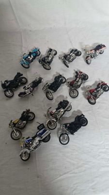 a lot of toy motorcycles that are sitting on a table