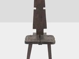 the chair is made of wood and has two legs