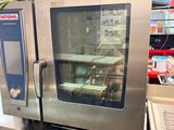 a silver oven sitting on top of a counter in a store