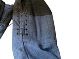 pair of blue jeans with laces on them on a white background