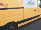 a yellow van that is parked in a parking lot