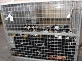 many bottles of wine in a cage on a cart