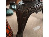 a close up of a table with a lamp on top of it