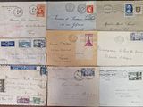 several old envelopes sitting on top of a wooden table