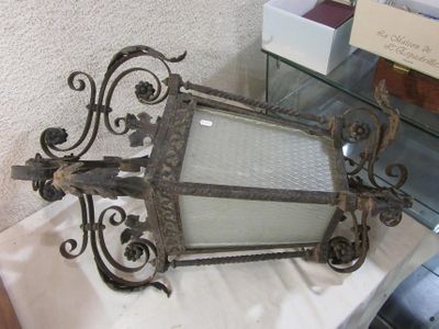 a large mirror sitting on a table next to a glass shelf