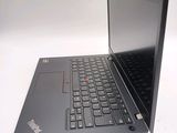 a laptop computer sitting on a table with a keyboard