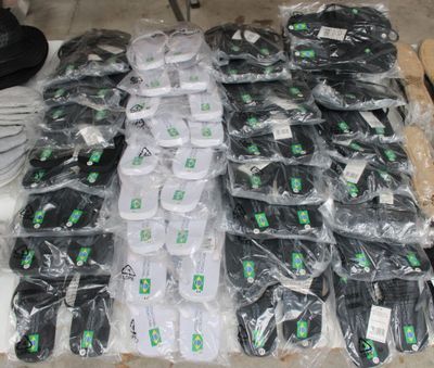 many bags of electronic equipment on a table