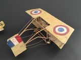 a model of a plane with a propeller and a small model of a plane with a propeller