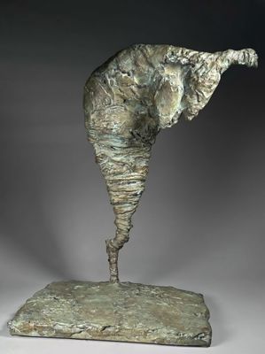 an image of a sculpture of an elephant standing on a rock