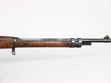 an old rifle with a wooden handle on a white background