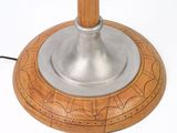 a wooden table lamp with a metal base on a white background