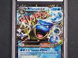 a close up of a card on a table with a black background