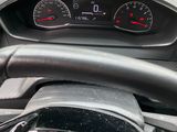 the dashboard of a car with a steering wheel and gauges