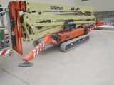 a picture of a crane that is parked in a parking lot