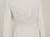 the back view of a white jacket on a mannequin mannequin