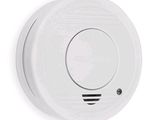 the smoke detector is located on the wall of the room