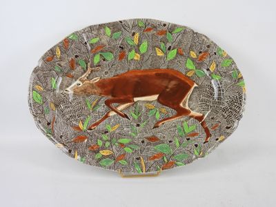 une image représentant une assiette sur laquelle est peinte une antilope