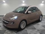 a picture of a brown smart car in a showroom