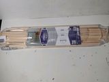 a package of wooden sticks sitting on a table
