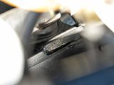 a close up of a motorcycle engine with a yellow light