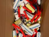 a cardboard box filled with toothbrushes and toothpaste