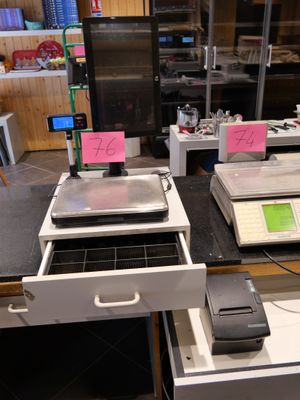many electronic devices on the counter in the kitchen