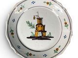 a plate with a picture of a lighthouse on it