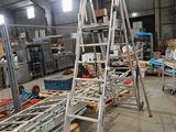 a ladder that is sitting in the middle of a room