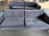 a blue couch that is sitting in a room