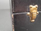a small black box with a gold lock on it