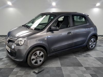 a picture of a small car that is parked in a garage