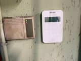 a picture of a door with a clock and a cell phone on it