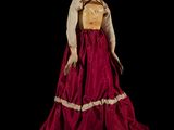 an image of a woman in a red and gold dress