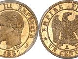 a gold coin with a woman ' s head and eagle on it