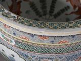 a close up of a decorative vase with animals on it