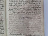 an old book with writing on it sitting on top of a table