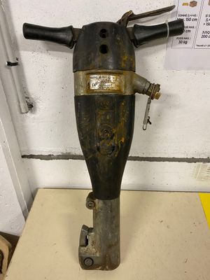 a black and gold fire extinguisor on a table
