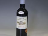 a bottle of wine that is sitting on a table
