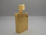 a gold lighter that is sitting on a table