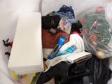 a bag full of items that are sitting in a trash can